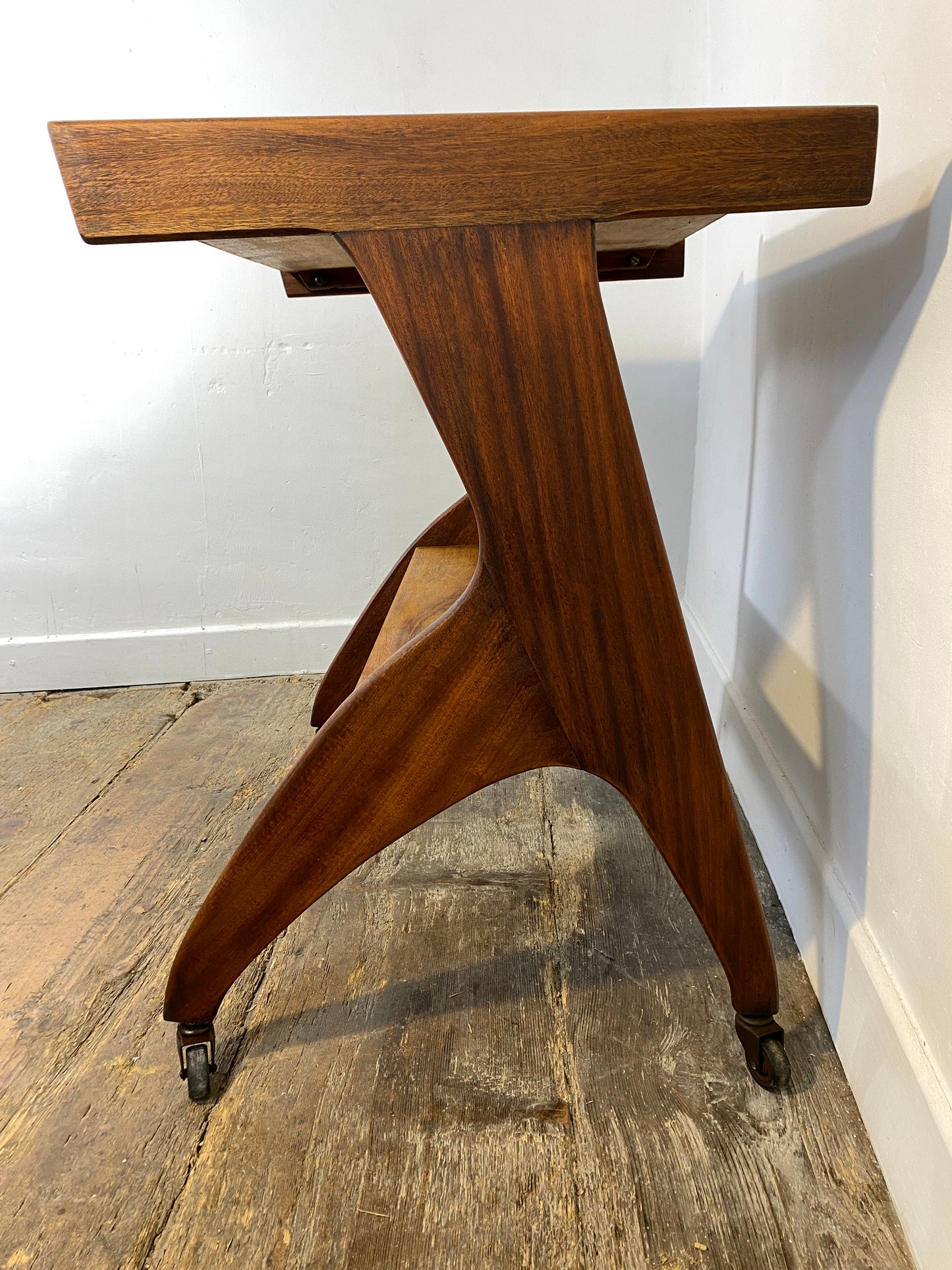 Vintage 1950s Mid-Century Modern Side Table on Casters – Sculptural Solid Wood Design